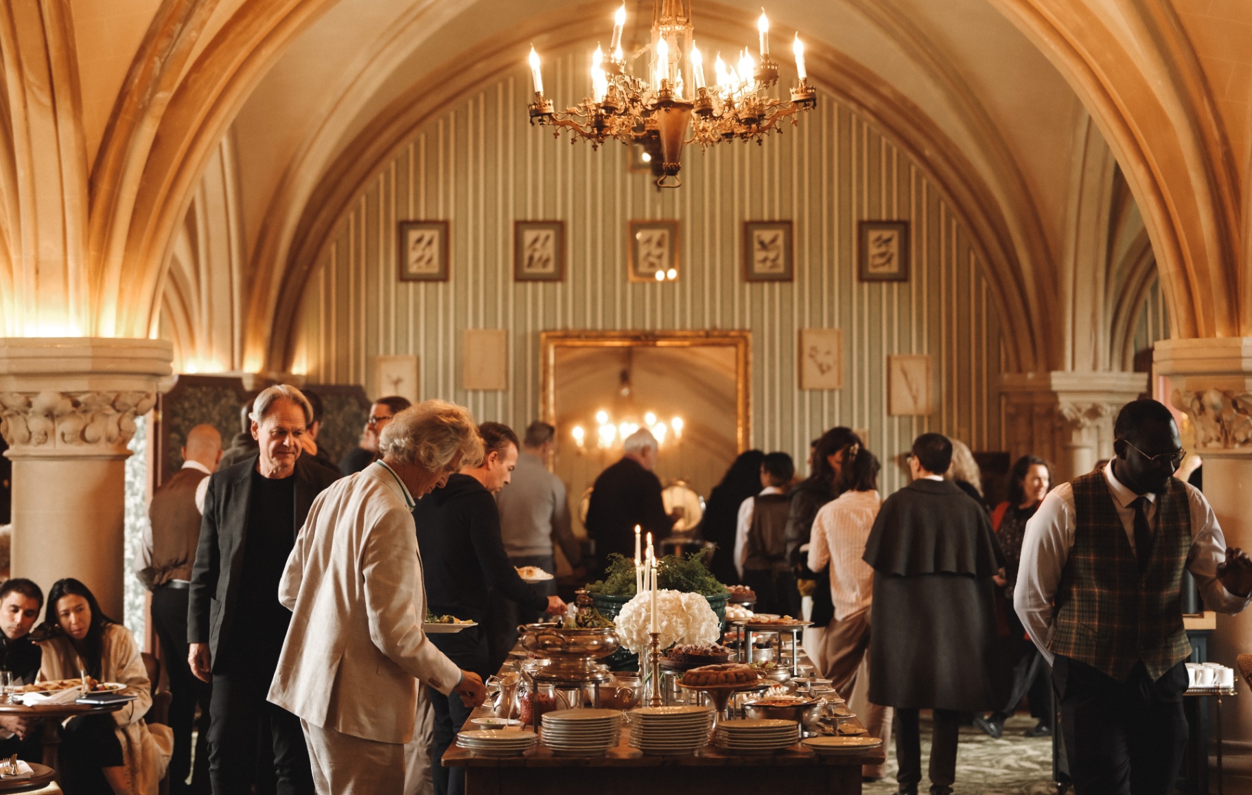 Odyssey guests gathered in a vaulted dining hall.