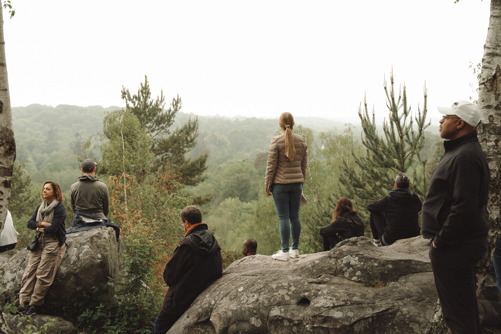 Odyssey guests taking in a forest overlook during a hike.